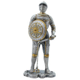 Statue of a knight in armor holding a shield on a white background