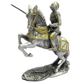 Metallic figurine of a knight on horseback with armor and spear, on a white background