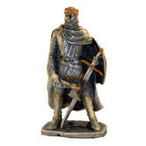 Statue of a warrior in armor with a shield, sword and axe on a white background