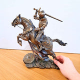 Large mounted knight with sword pictured with hand for scale