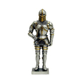 A metal figurine of a knight in armor with a flail, featuring gold and silver colors and intricate details.