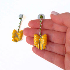 Bow Yellow Enamel and Crystal Earrings pictured on hand for scales