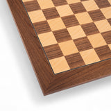 Close-up of a wooden chessboard with checkered pattern
