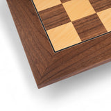Wooden chessboard with checkered pattern on a white background