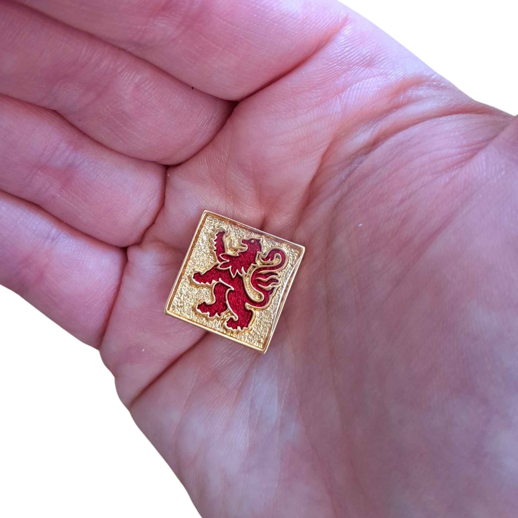 Lion Rampant Red and Gold Badge Pin in hand for scale