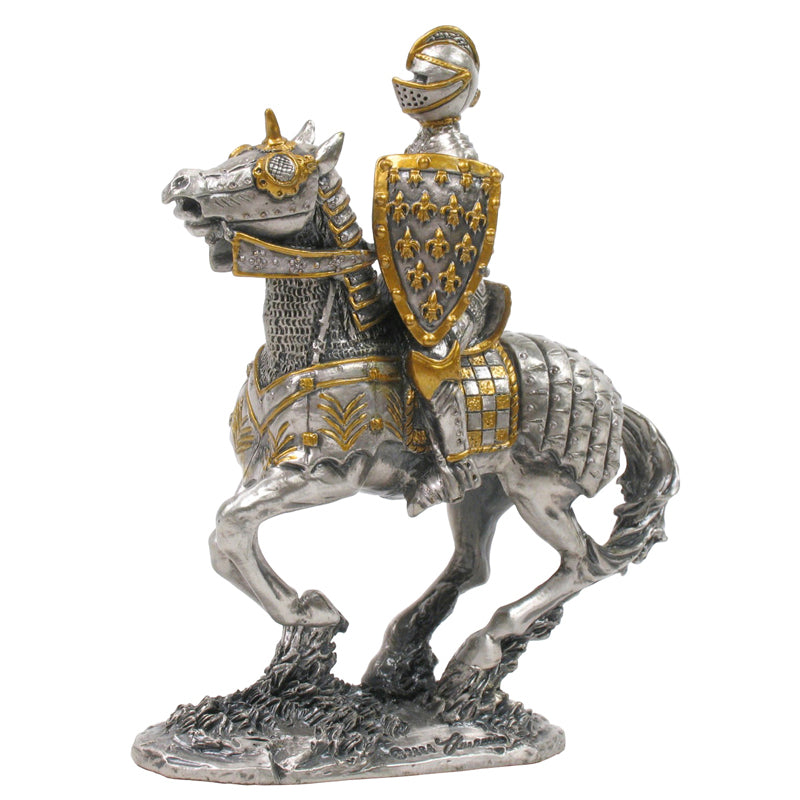 Decorative figurine of a knight on horseback with armor and shield on a white background