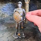 Knight with Shield and Flail metal Statue with hand pictured for scale