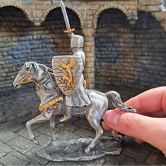 Mounted knight with lion shield model with hand pictured for scale