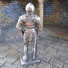 Knight in armour metal statue back view